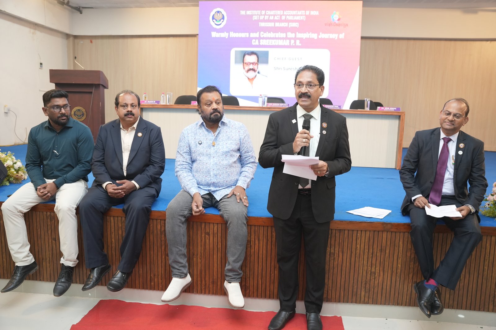 HONOURING CA.SREEKUMAR BY Shri SURESH GOPI M P