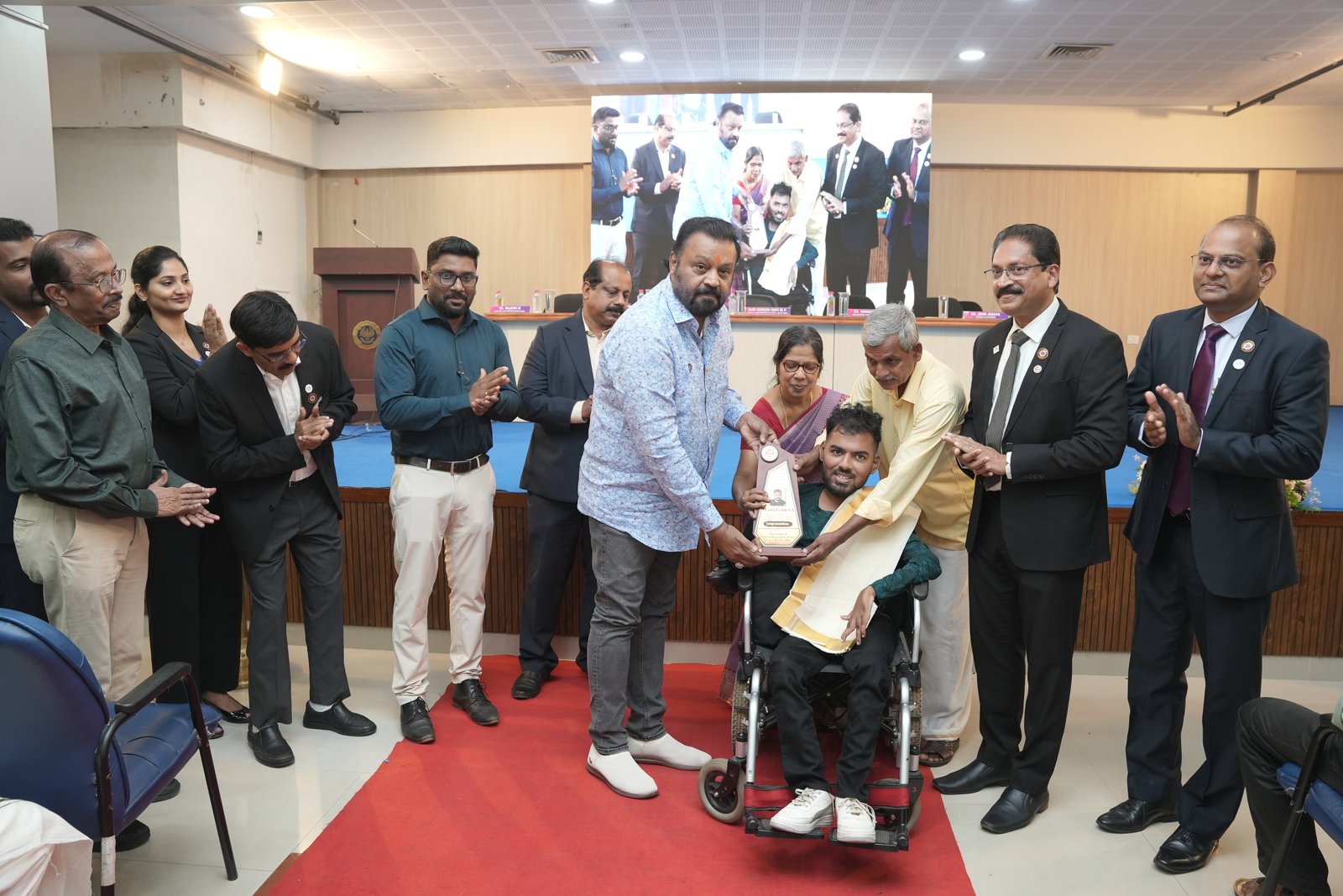 HONOURING CA.SREEKUMAR BY Shri SURESH GOPI M P