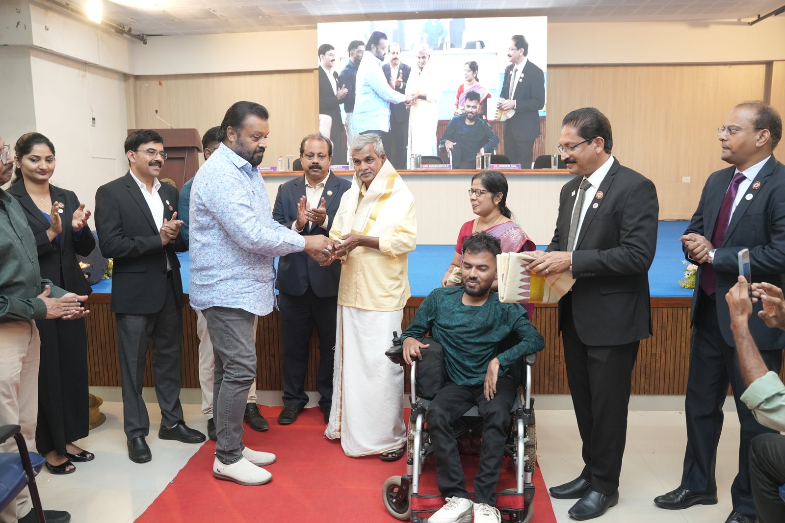 HONOURING CA.SREEKUMAR BY Shri SURESH GOPI M P