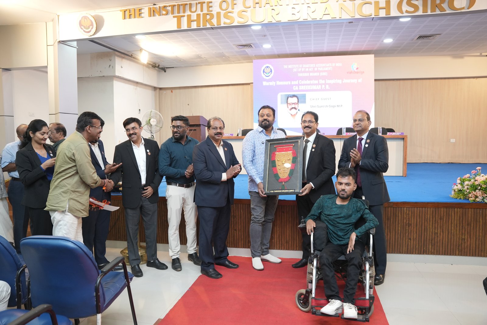 HONOURING CA.SREEKUMAR BY Shri SURESH GOPI M P